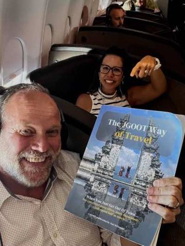 Joel McDonald reading The JGOOT Way of Travel on a Virgin flight